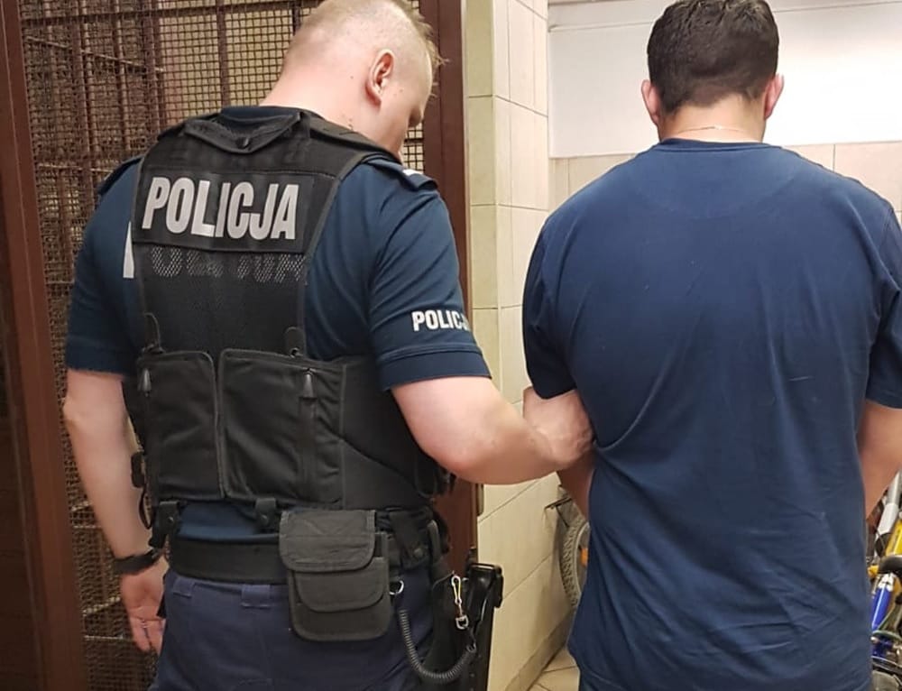 Police officer arresting a suspect. POLICJA.