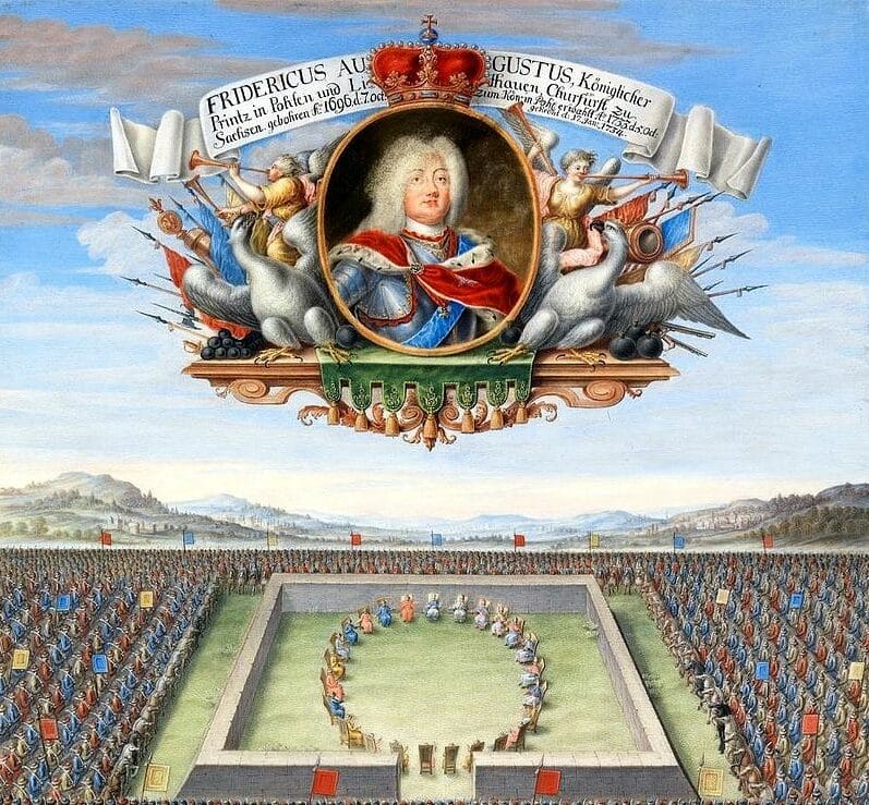 Portret Fryderyka Augusta II, króla Polski i elektora Saksonii, otoczony motywami o charakterze militarnym oraz ilustracją przeglądu wojskowego.