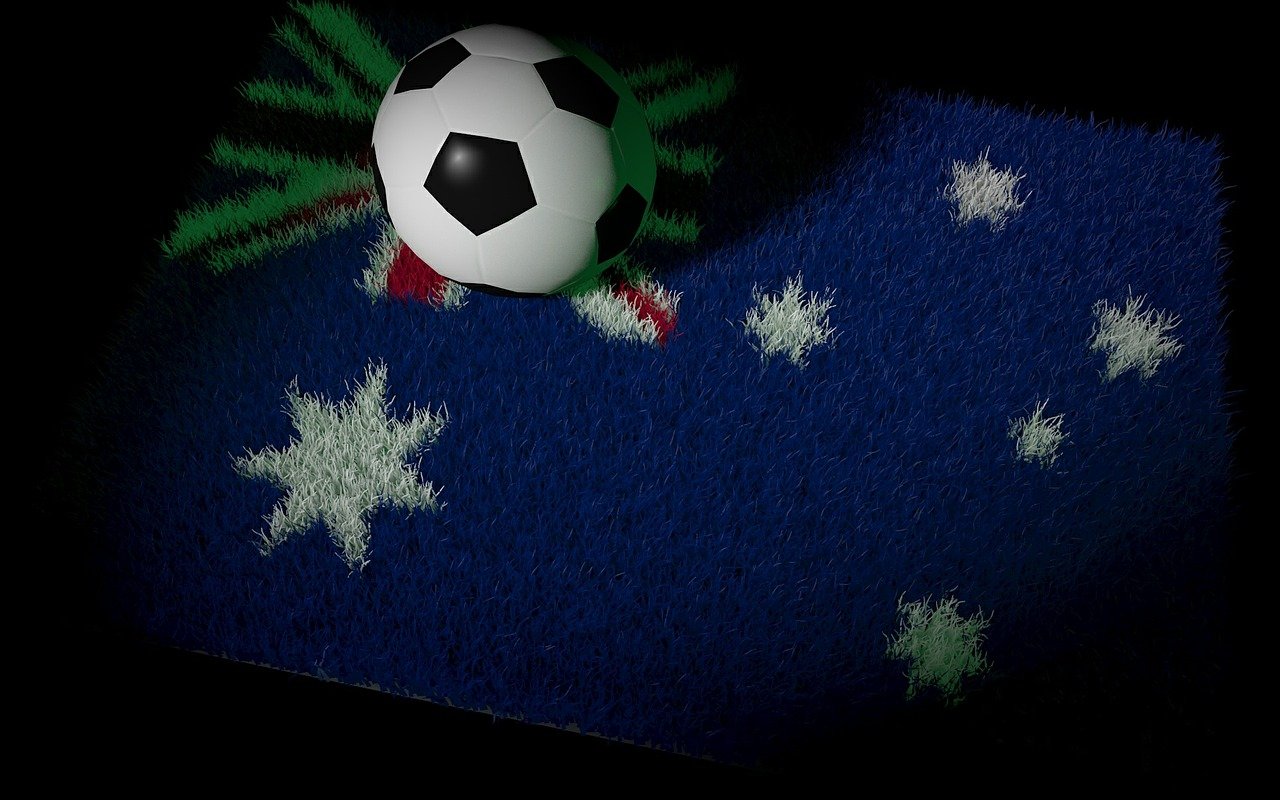 Piłka nożna na trawie w stylu flagi australijskiej