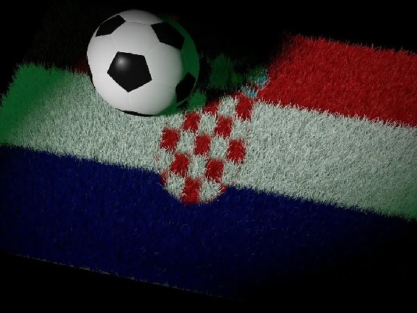 Piłka nożna na murawie z motywem chorwackiej flagi