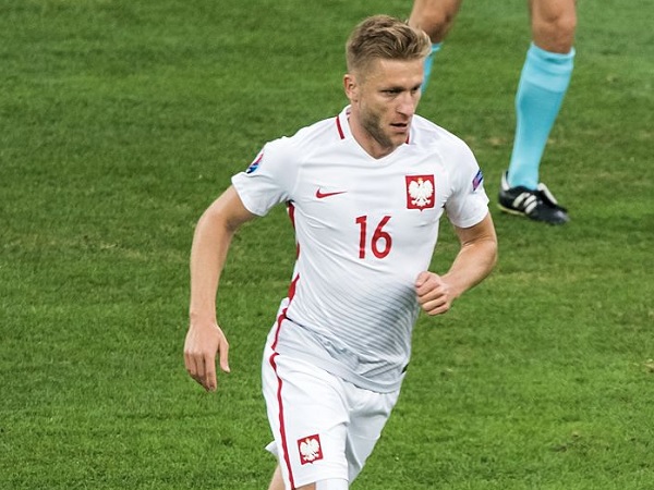 Polski piłkarz Jakub Błaszczykowski (numer 16) w akcji