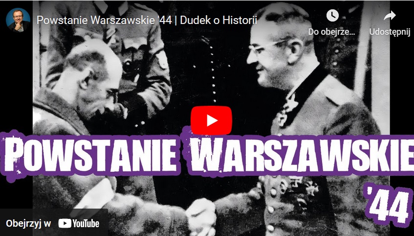 Czarno-białe zdjęcie Powstania Warszawskiego, 1944 r. Dwóch mężczyzn ściska sobie dłonie; jeden w ubraniu cywilnym, drugi w mundurze.