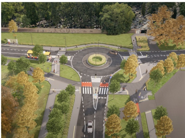 Widok z lotu ptaka na nowoczesne rondo ze ścieżkami dla pieszych i rowerzystów, będące przykładem urbanistycznego planowania.