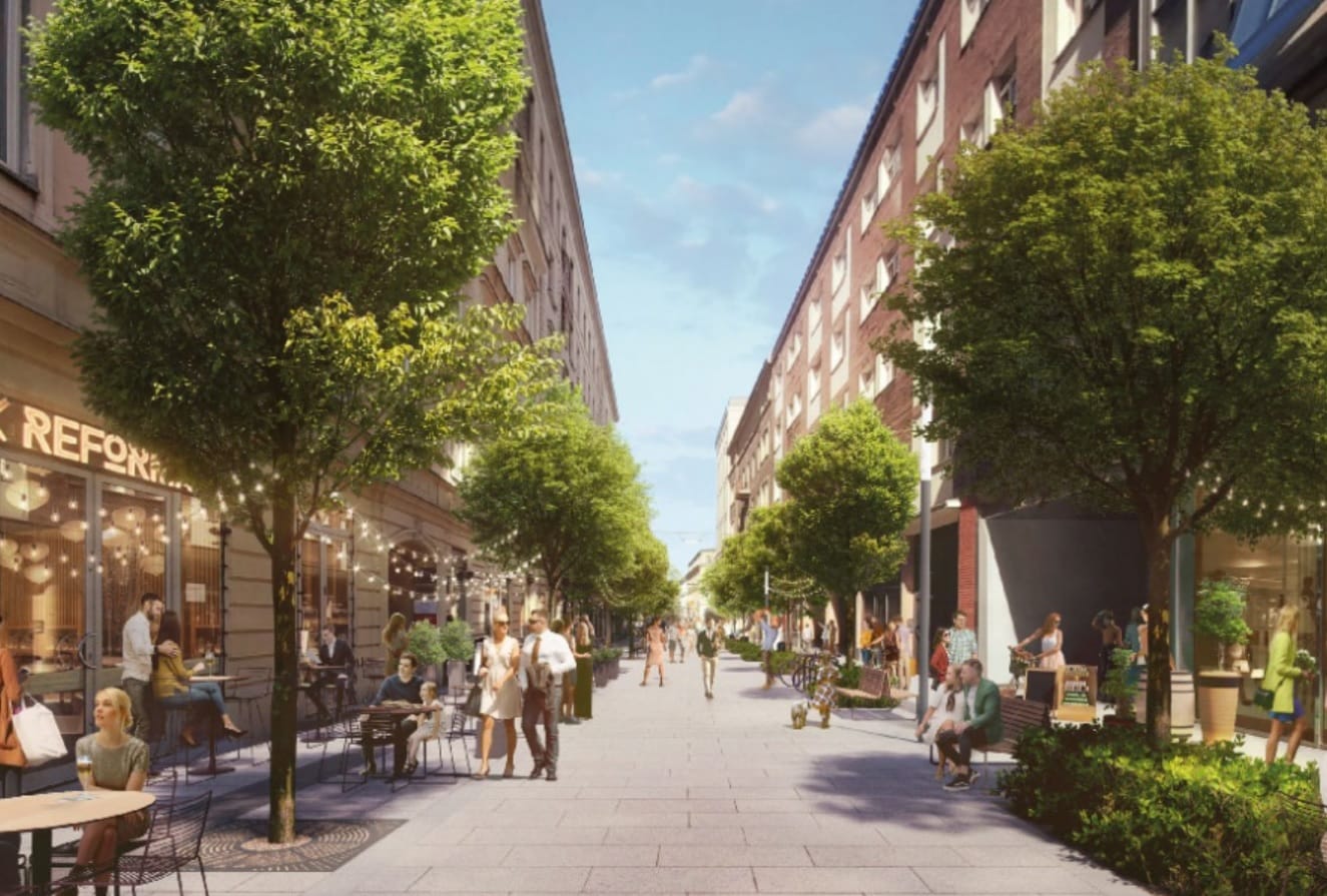 Przyjazna pieszym ulica ze sklepami i kawiarniami, będąca przykładem odnowy miasta.
